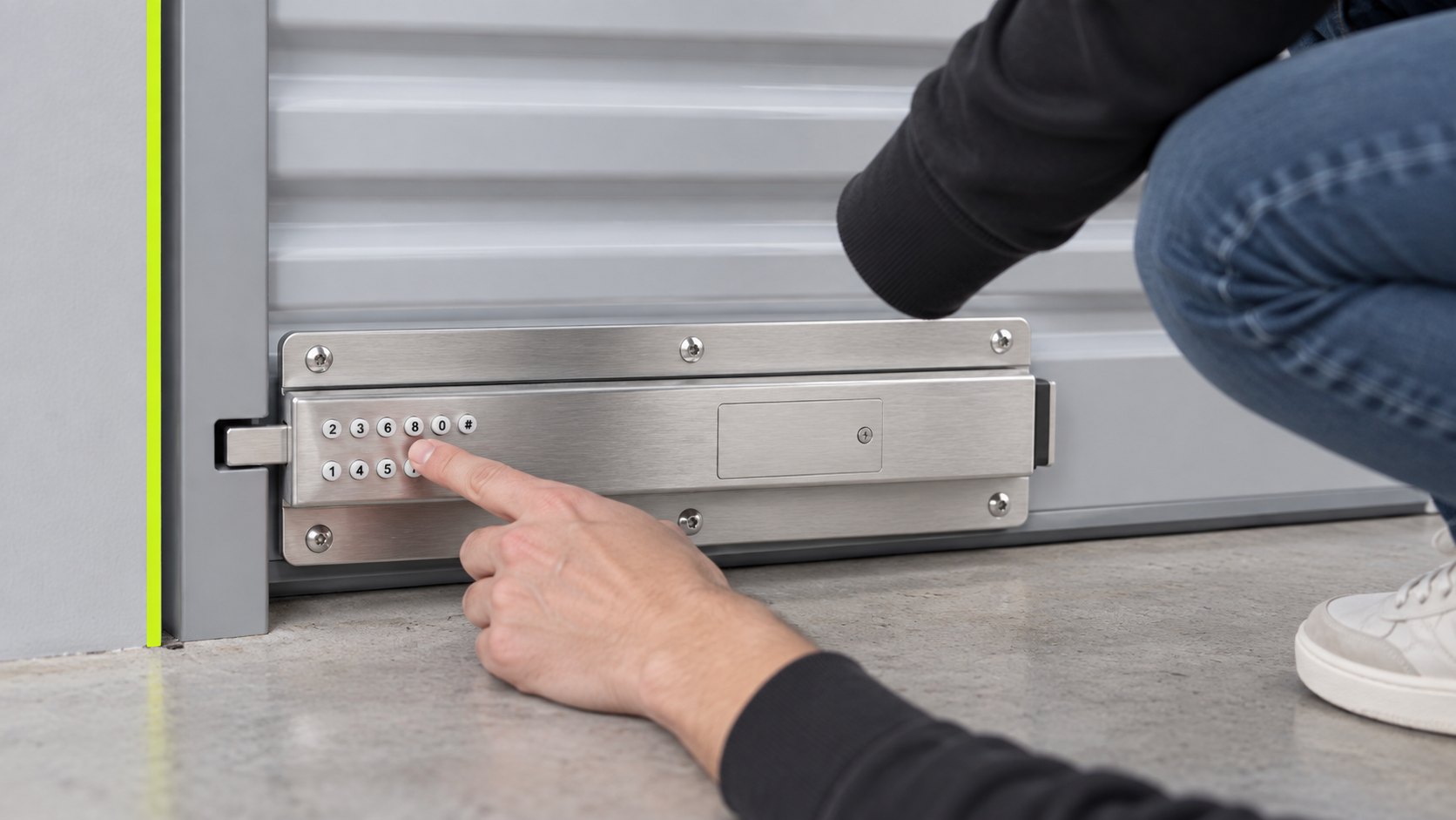 A tenant entering a code on the Smart Latch fitted to the bottom rail of a roller door